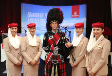 Scottish bagpiper with Emirates Crew.jpg