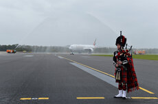 Scottish bagpiper and water cannon salute.jpg