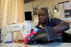 Raymond Phiri, owner of Motion Bags, makes the sustainable Emirates school bags.jpg
