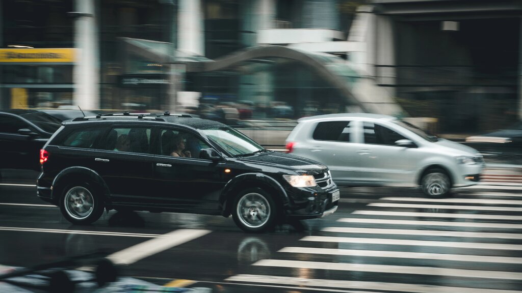 black-suv-beside-grey-auv-crossing-the-pedestrian-line-125514