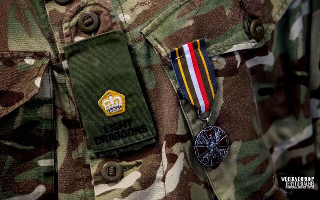 Srebrnego Medalu Wojska Polskiego dla majora Luke'a Dodingtona