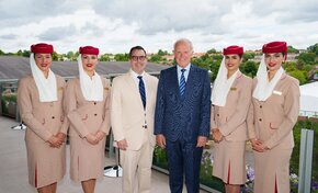 Lew Sherr, CEO and Executive Director, USTA, and Sir Tim Clark, President, Emirates airline, with members of the Emirates Cabin Crew.jpg