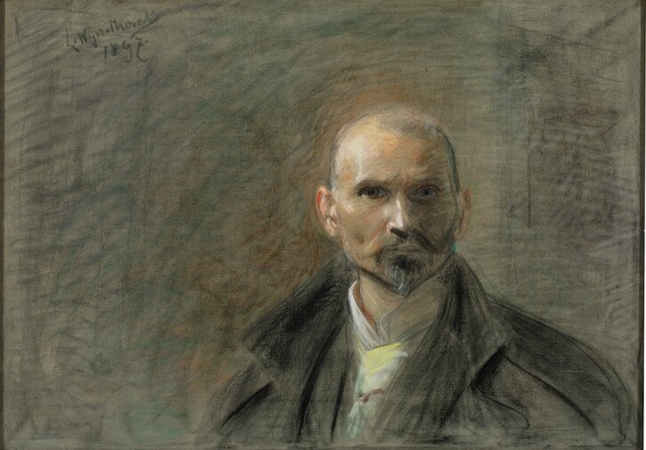 „Leon Wyczółkowski, Autoportret”, 1897, pastel na płótnie
Portret mężczyzny w średnim wieku z krótkimi włosami, brodą i przenikliwym spojrzeniem. Tło utrzymane jest w zgaszonych, ziemistych tonacjach, co podkreśla surowość i introspekcyjny charakter dzieła.